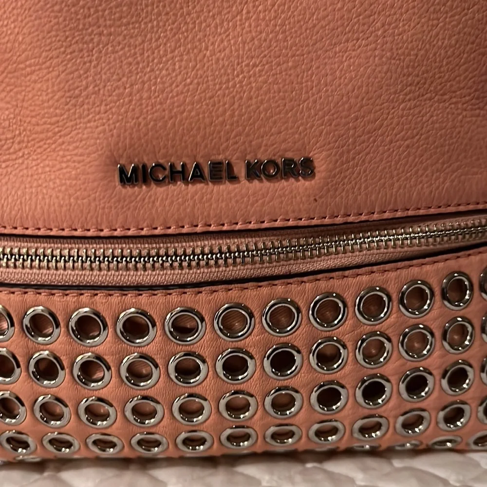 Michael Kors Rhea Medium Silver-Ringed Backpack with Fur Pompom in Coral…
